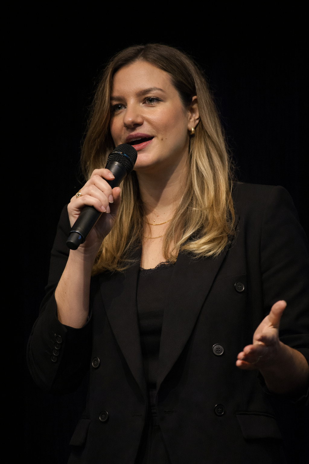 Mel on stage delivering a keynote